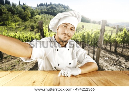 cook chef making selfie in vineyard in Italy 