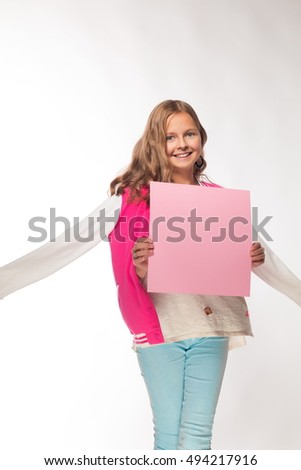 Emotional blonde girl in a pink jacket with a pink sheet of paper for notes.