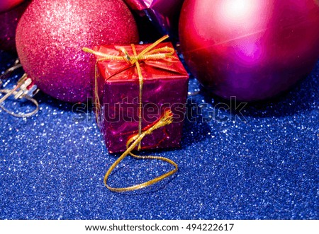 Gifts and Christmas decorations on bright blue background