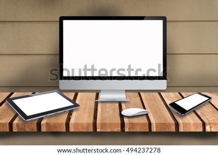 Laptop, tablet, smartphone computer on wooden table can be used 