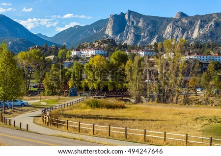 Estes Park - An autumn afternoon at Downtown Estes Park, with The Stanley Hotel and Rocky Mountains in background. Colorado, USA. Royalty-Free Stock Photo #494247646