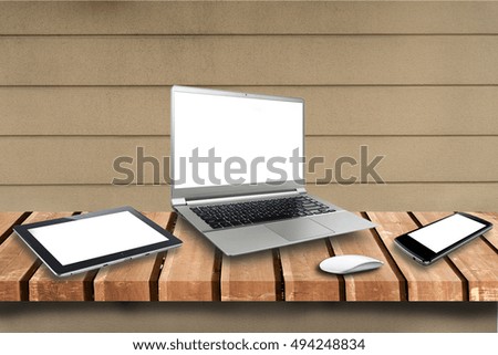 laptop, tablet, smartphone on wooden table