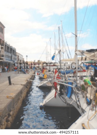 Defocused background of a modern boats at the Venetian port of Chania. Intentionally blurred post production for bokeh effect.