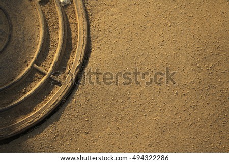 Metal drain lid or manhole cover abstract metallic circle