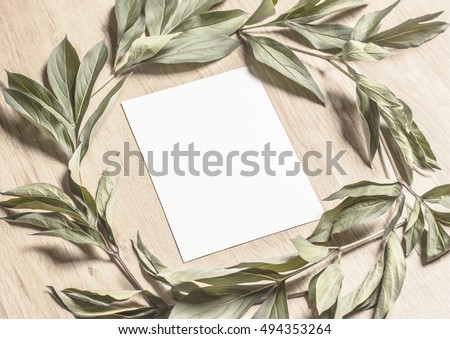 Mockup With A Card And Green Leaves