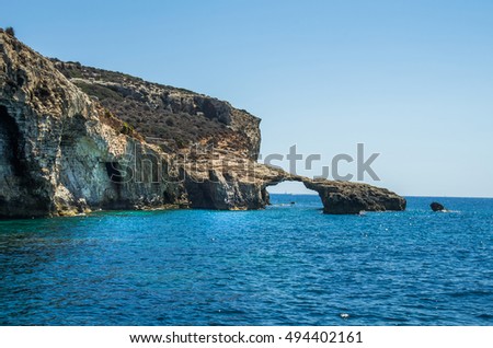 Azure sea and natural arch in the rocks on the island of Gozo