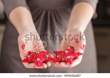 red Christmas ornament in the shape of a star.