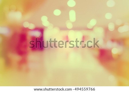 shopping mall blurred background.