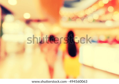 shopping mall blurred background.