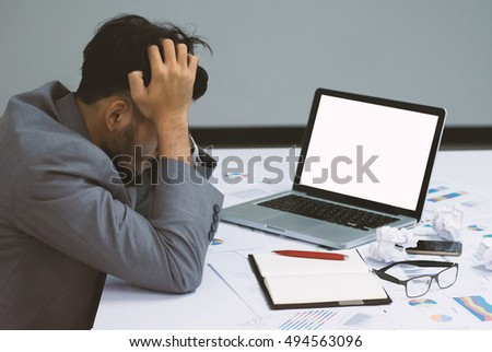 Businessman having stress over laptop in the office
