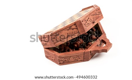 Wooden chess case and pieces. Isolated on white background. Slightly de-focused and close-up shot. Copy space.