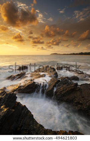 Beautiful sunrise in rocky area taken with Slow Shutter. Soft Focus Motion Blur due to Slow Shutter Speed. Copy Space Area