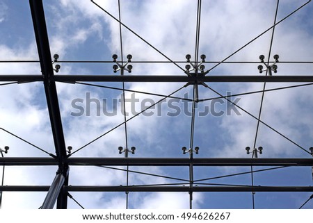 Panoramic structural glass roof. Modern office architecture with modular fragmentation / regular framework.