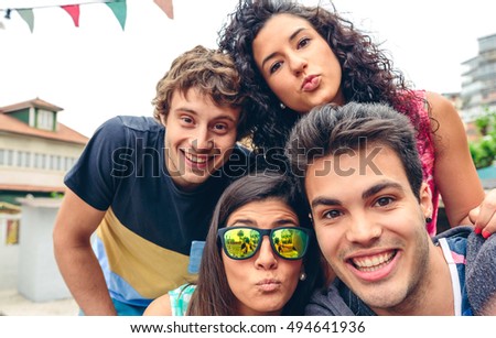 Young people having fun in summer party outdoors