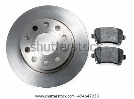 a car brake disc and pads on white background