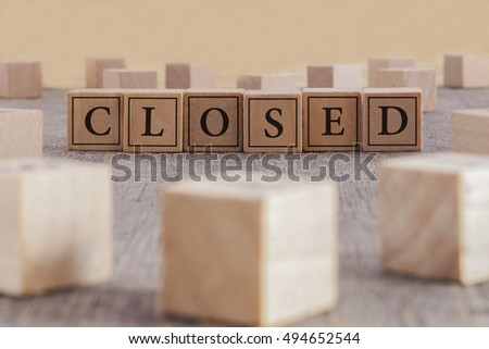 CLOSED word written on building blocks concept