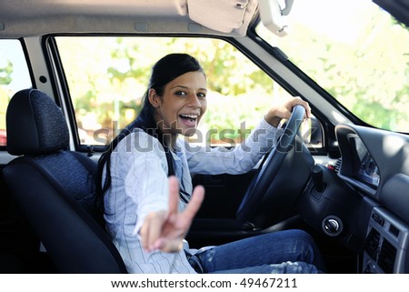 new car: teenage girl showing victory sign