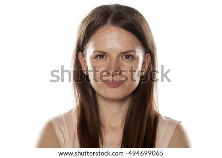 Portrait of a smiling young woman without makeup Royalty-Free Stock Photo #494699065