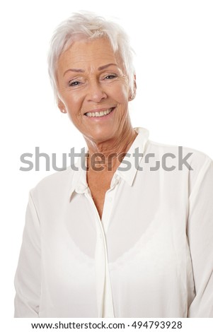 confident mature woman in her sixties wearing white blouse