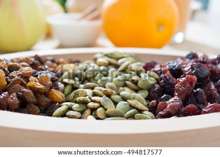 Dry fruit with pumpkin seed in the wooden bowl