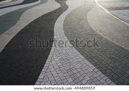 Wavy lines of modern pavement. Abstract textured background.
