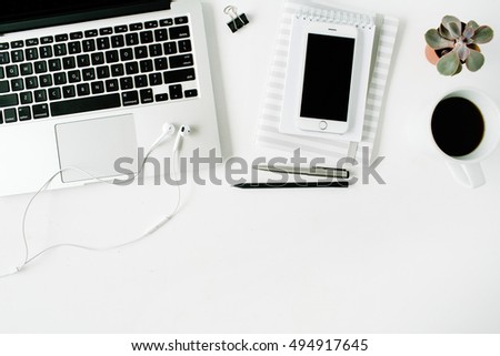 Flat lay home office workspace with laptop, diary, phone, coffee, succulent on white background.