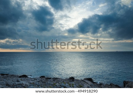 Seascape Croatia Europe. Beautiful nature and landscape photo of Adriatic Sea in Dalmatia. Nice warm summer evening at sunset. Lovely colorful outdoors image. Calm peaceful ocean and cloudy sky.