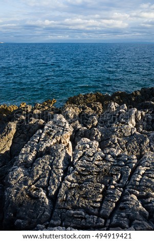 Seascape Croatia Europe. Beautiful nature and landscape photo of Adriatic Sea In Dalmatia. Rock,stone reef and ocean. Nice warm summer evening. Calm, peaceful, happy and joyful outdoors picture.