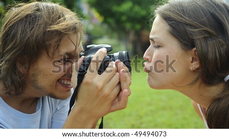 Gorgeous couple take pictures in the park