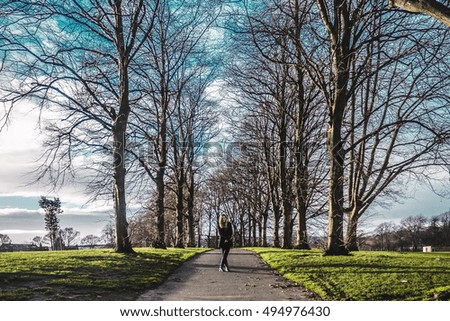 Photo of Girl in the middle of trees in Edinburgh, Scotland