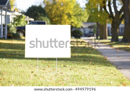 blank yard sign during sunny autumn weather Royalty-Free Stock Photo #494979196