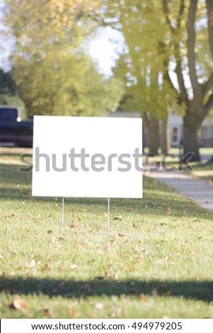 blank yard sign during sunny autumn weather