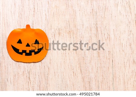 Black and orange pumpkins on wooden background
