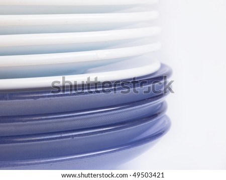 white and blue plates in a stack