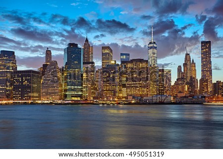 The Manhattan seen from across the East River at dusk. New York City at night.