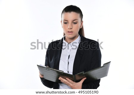 Business woman writing on the clipboard acting surprised