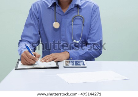 Doctor writing a medical prescription.