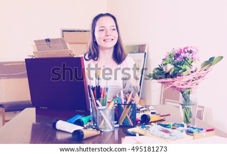 Young girl fascinated by the process of creating a new picture
