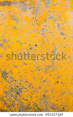 grime of cement on rusty yellow metal plate background