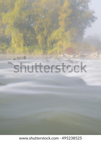 Small river in the autumn season with long exposure