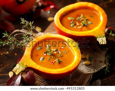 Pumpkin soup served in a hollowed pumpkins
