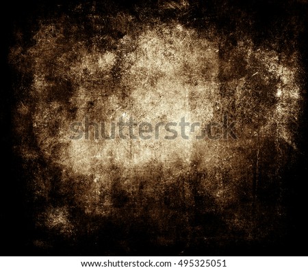 Beautiful brown abstract vintage grunge background with faded central area for your text or picture, scratched scary halloween background with frame