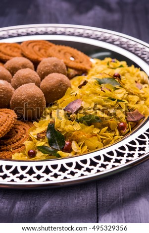 Plate full of sweet and salty Diwali food / snacks
