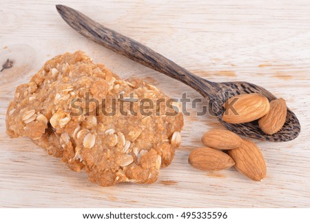 Cookie and Almonds on the wooden floor