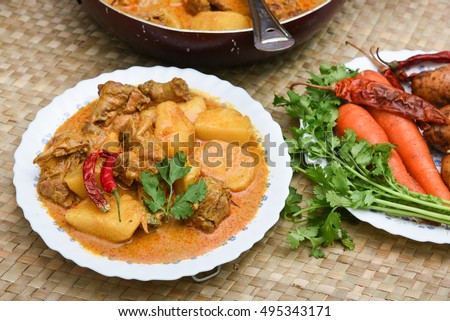 Hot spicy Kerala chicken curry with potato and coconut milk, Indian food korma chicken / masala curry / roast. side dish for roti / chapathi / chapati / naan / paratha rice. thai cuisine with cut veg