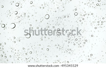 Light and shadow pattern of water droplets white background  Royalty-Free Stock Photo #495345529