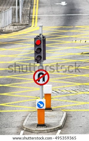 city street view day traffic light red stop signal with no u-turn traffic sign road markings right hand drive traffic direction exterior aerial detail cityscape transportation signs scene theme