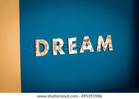 Blue Background with an Inscription Dream