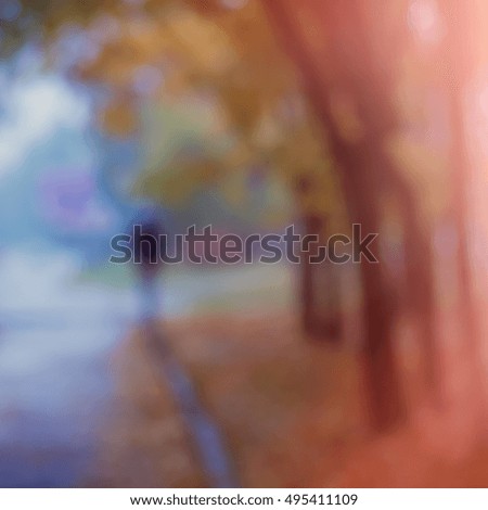 silhouette of man in the rain go in autumn park, blurred background