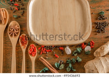 Group of Asias spices and herbs on brown background